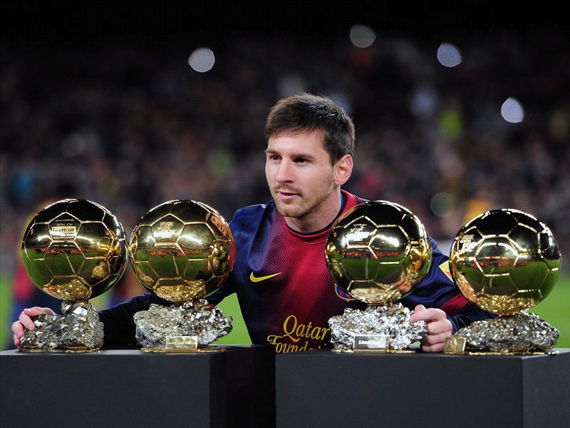 lionel-messi-poses-with-4-ballon-d-or-awards-before-fc-barcelona