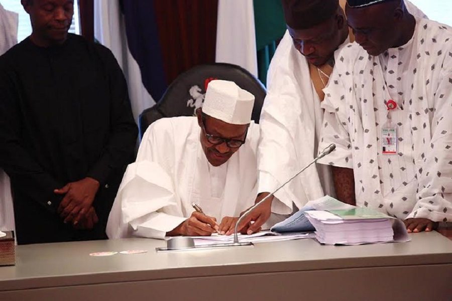 Image result for Buhari signs eight bills into law