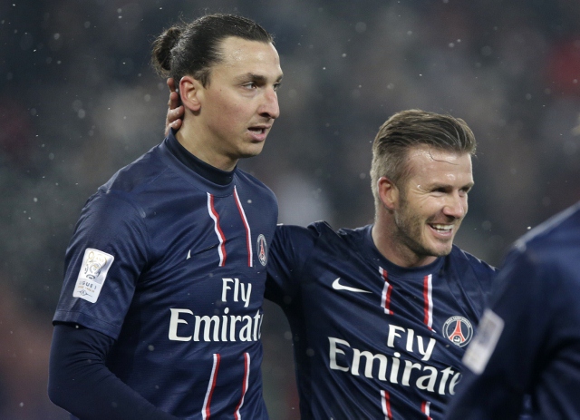 Paris Saint-Germain's Beckham congratulates Ibrahimovic after his goal against Olympic Marseille in their French Ligue 1 soccer match at Parc des Princes stadium in Paris