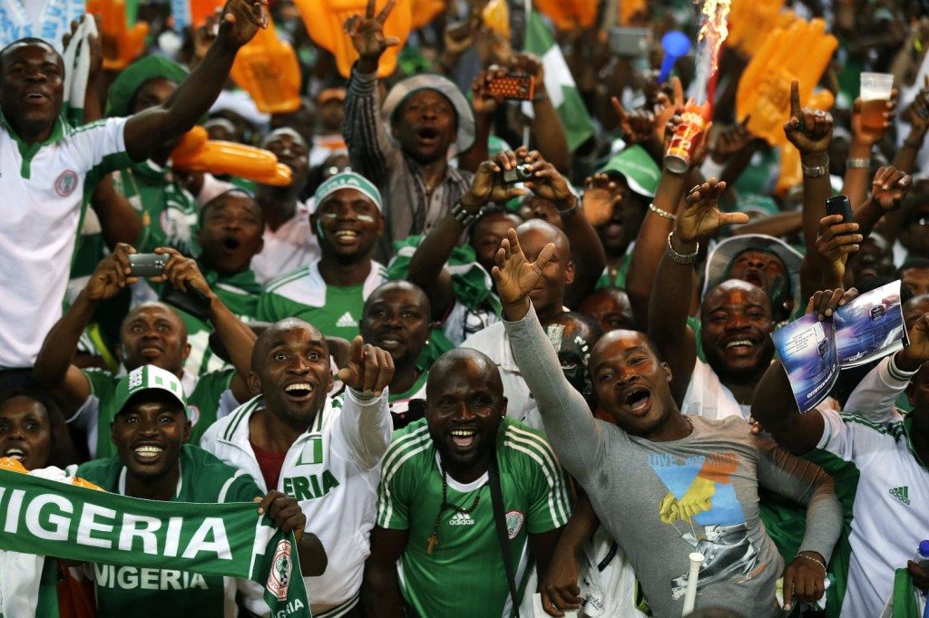 Nigeria fans celebrate in the stands as their team defeated Burkina Faso 1-0 in the final to win the African Cup of Nations soccer tournament, at Soccer City Stadium in Johannesburg, South Africa, Sunday, Feb. 10, 2013. (AP Photo/Rebecca Blackwell)