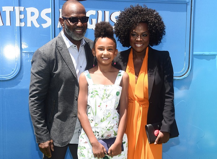 Davis, her husband and their daughter Genesis